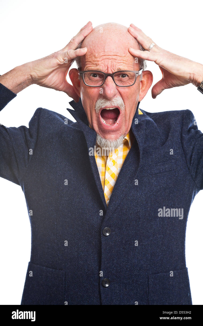 Angry well dressed senior man with glasses. Isolated. Stock Photo