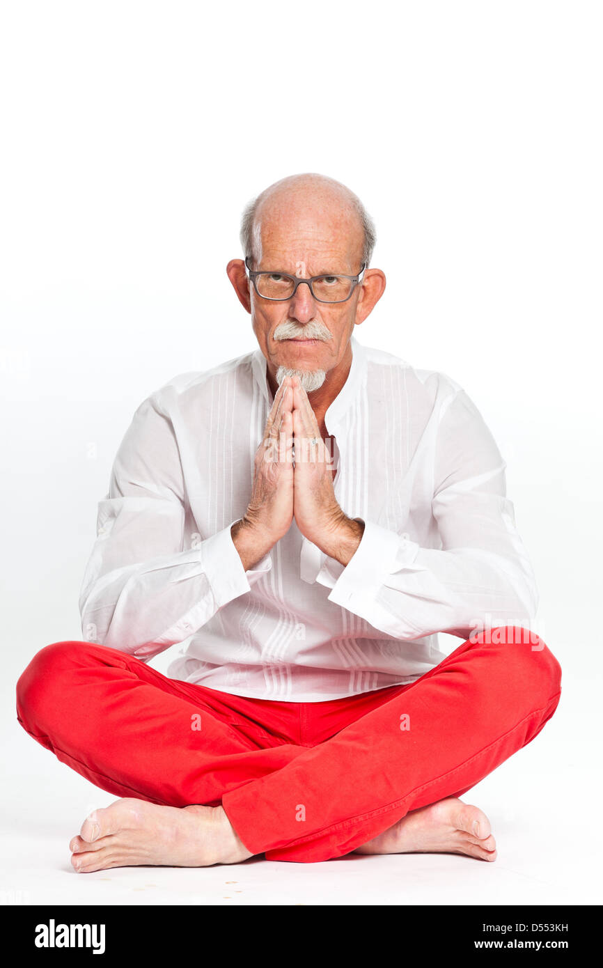 Spiritual senior man with glasses. Isolated on white. Stock Photo