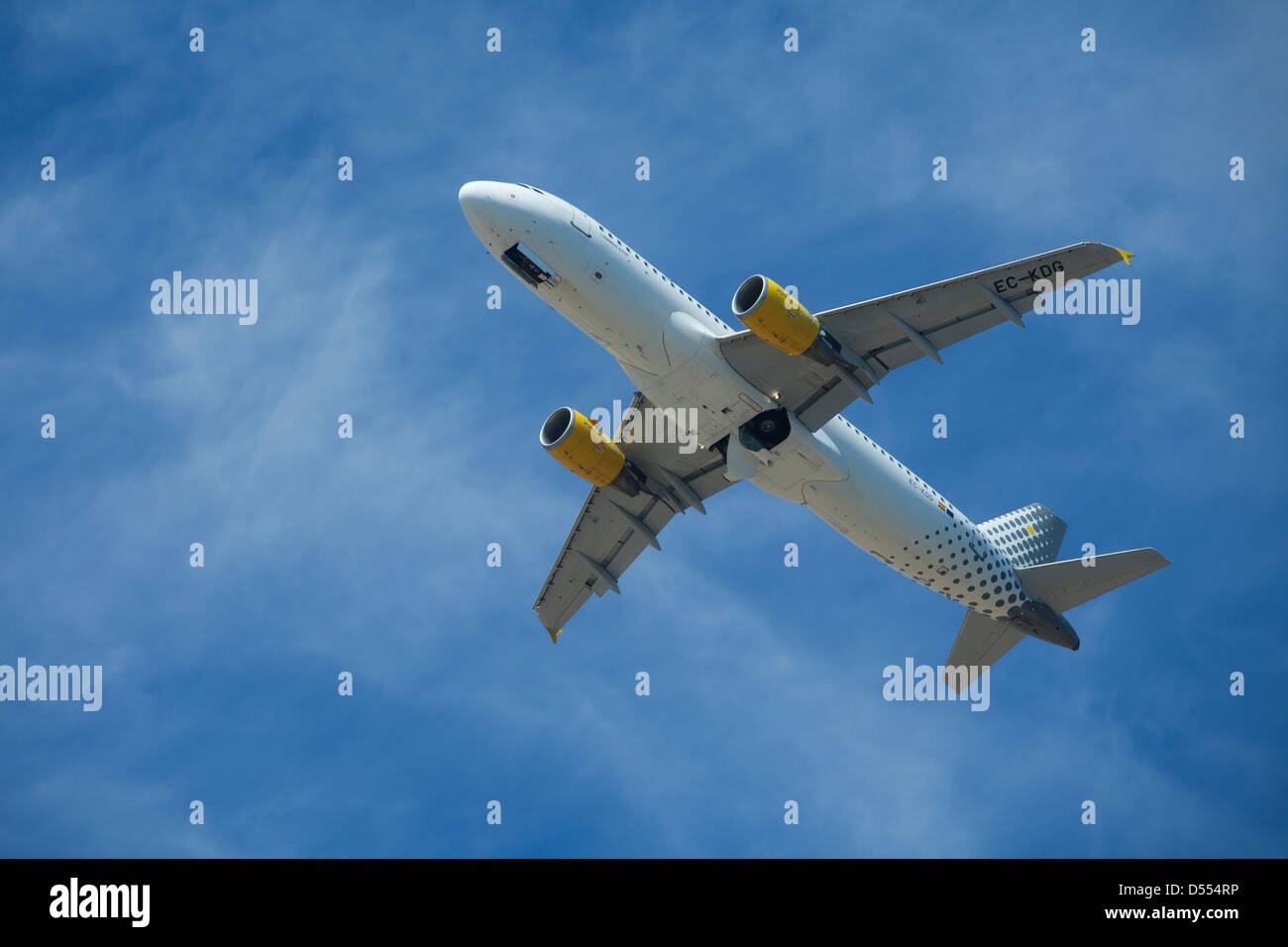 Airplane taking off in a blue sky Stock Photo - Alamy