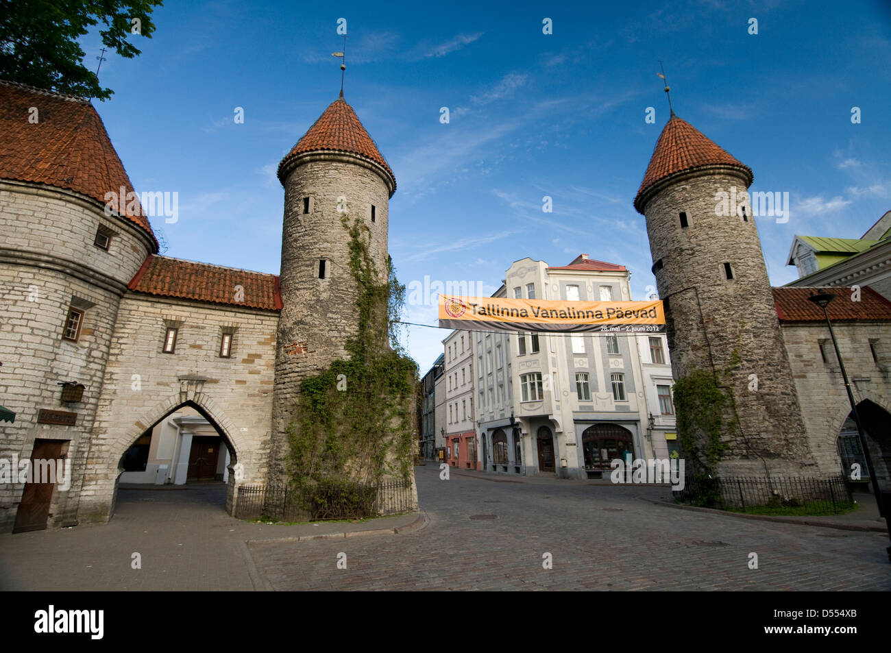 The twin towers of Viru Gates, built in the 13th century are part of the surrounding old city wall. It is one of the main entrances to Tallinn Old Stock Photo