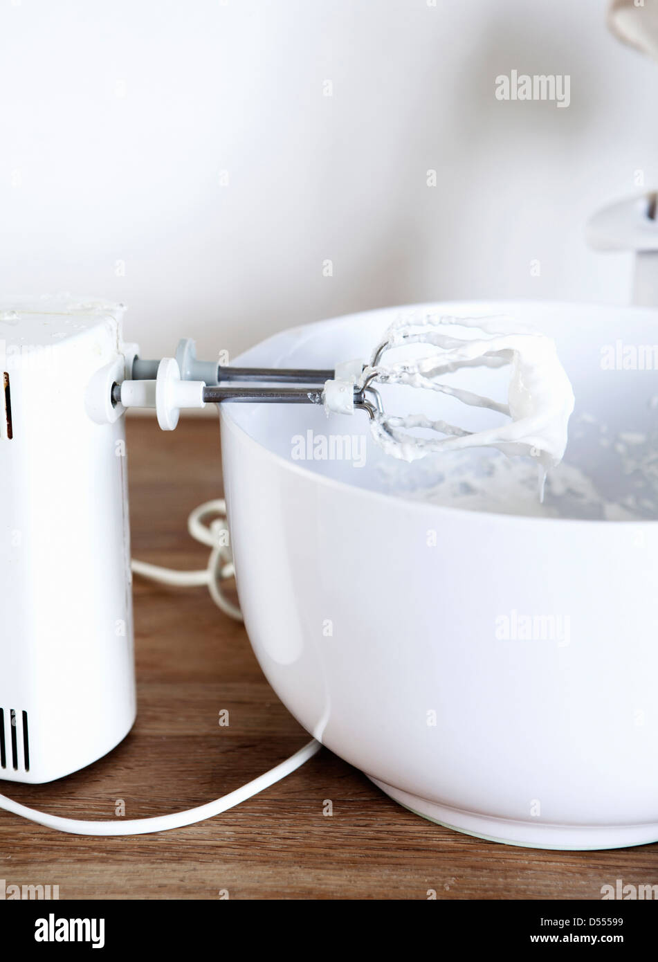 Electric mixer with whipped cream Stock Photo Alamy