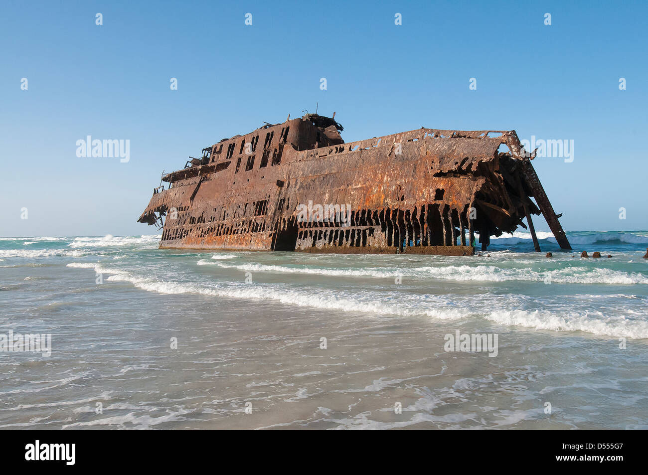 Shipwreck stranded on beach Stock Photo