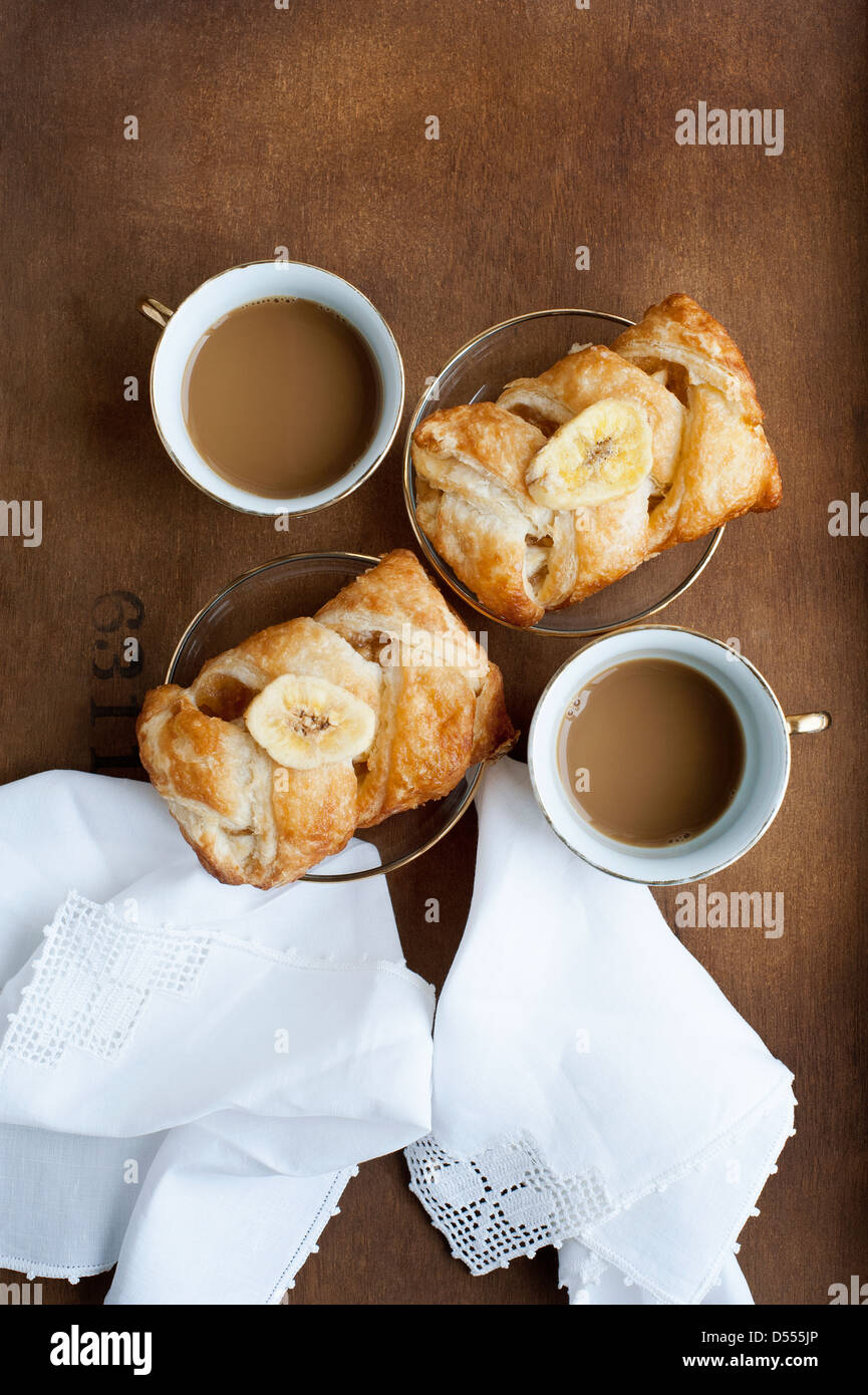 Baked pastries with banana and coffee Stock Photo Alamy