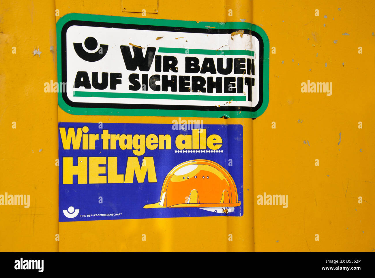 ILLUSTRATION - A file picture dated 03 September 2011 shows two stickers with the letterings 'We build on security' and 'We all wear Helmets' attached to a construction site trailer in Berlin, Germany. Fotoarchiv für Zeitgeschichte/Steinach () Stock Photo