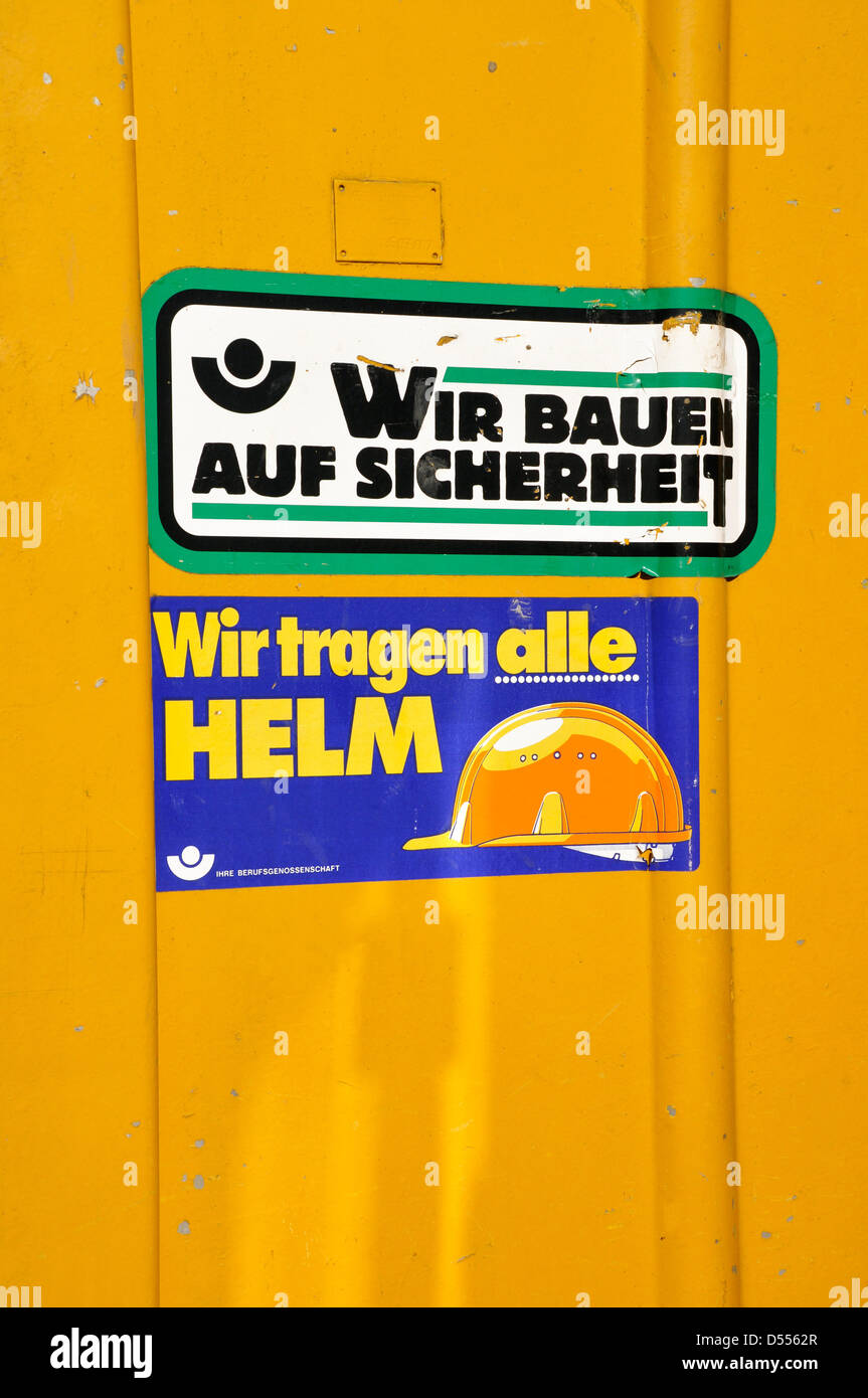 ILLUSTRATION - A file picture dated 03 September 2011 shows two stickers with the letterings 'We build on security' and 'We all wear Helmets' attached to a construction site trailer in Berlin, Germany. Fotoarchiv für Zeitgeschichte/Steinach () Stock Photo