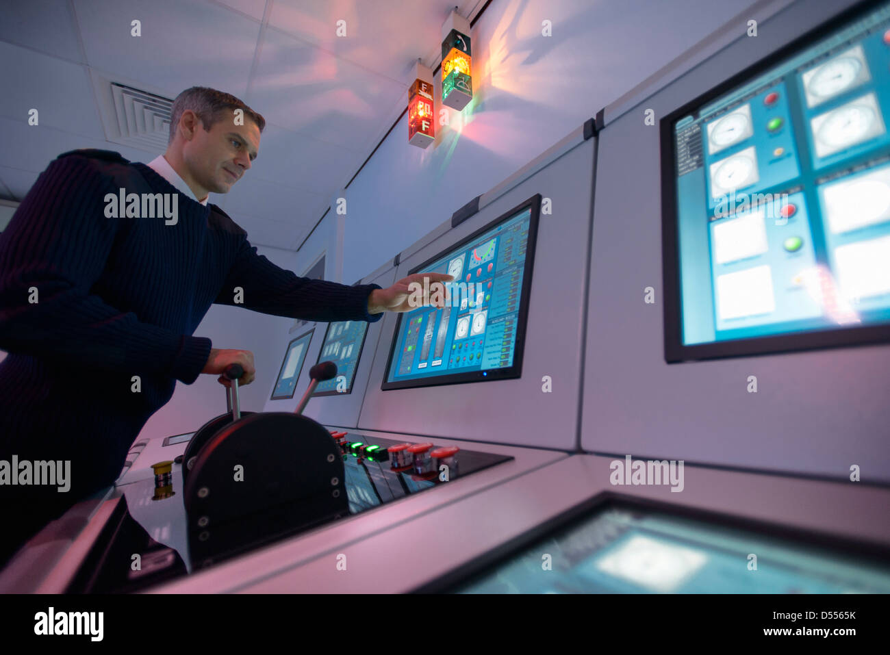 Personnel working in ships engine room Stock Photo Alamy