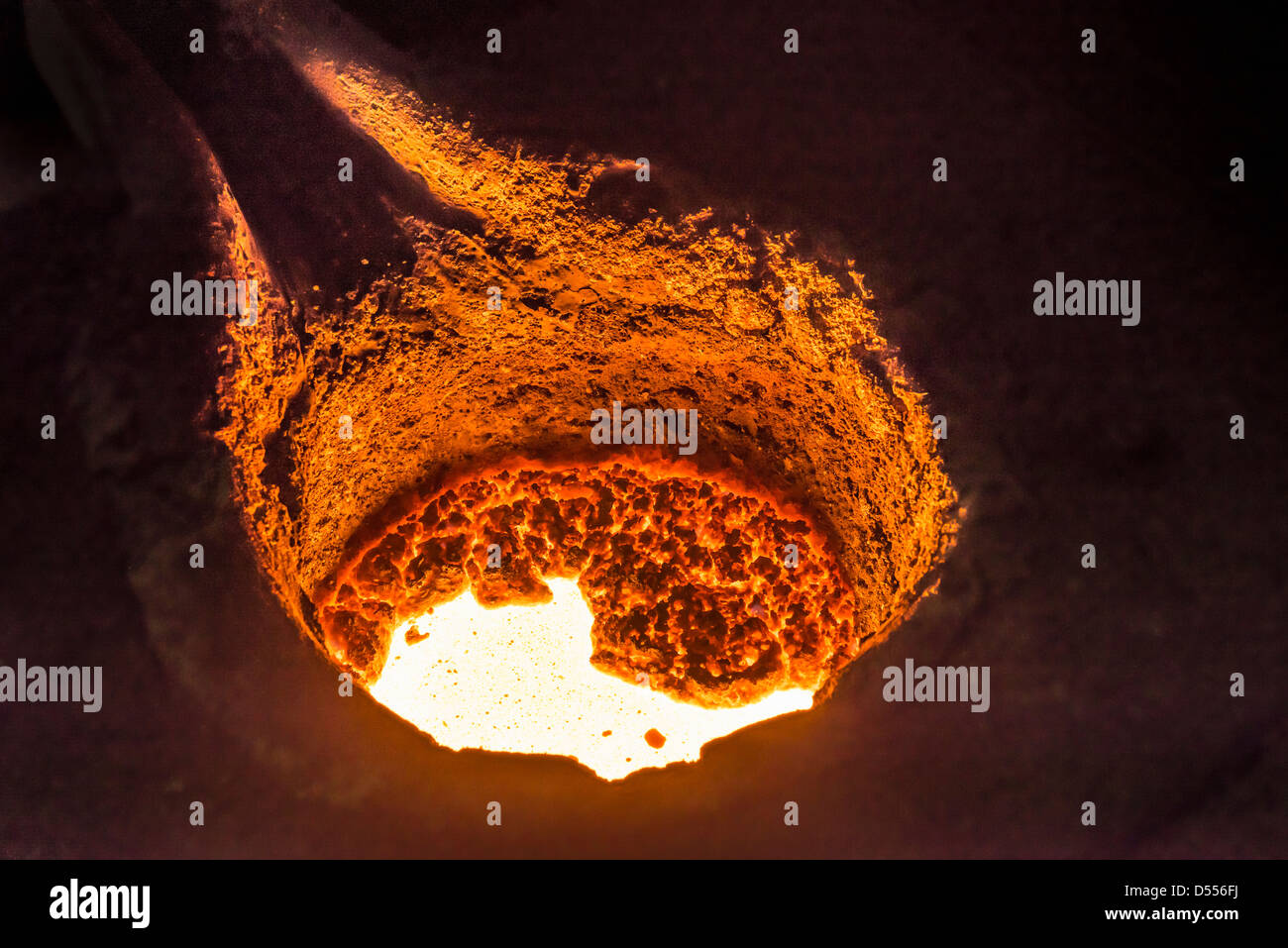 Molten metal in flask in foundry Stock Photo