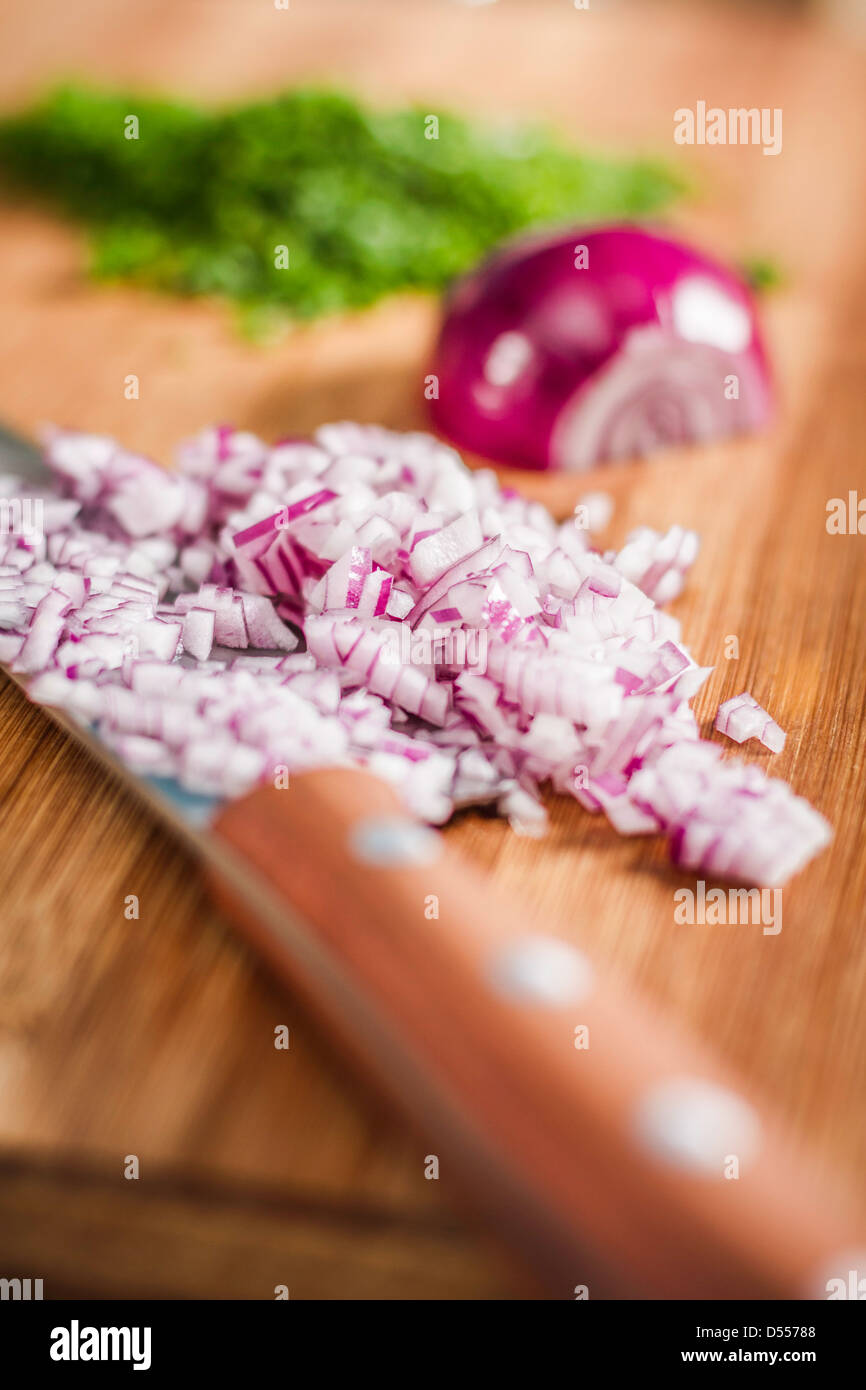 Close up of knife and chopped onions Stock Photo - Alamy