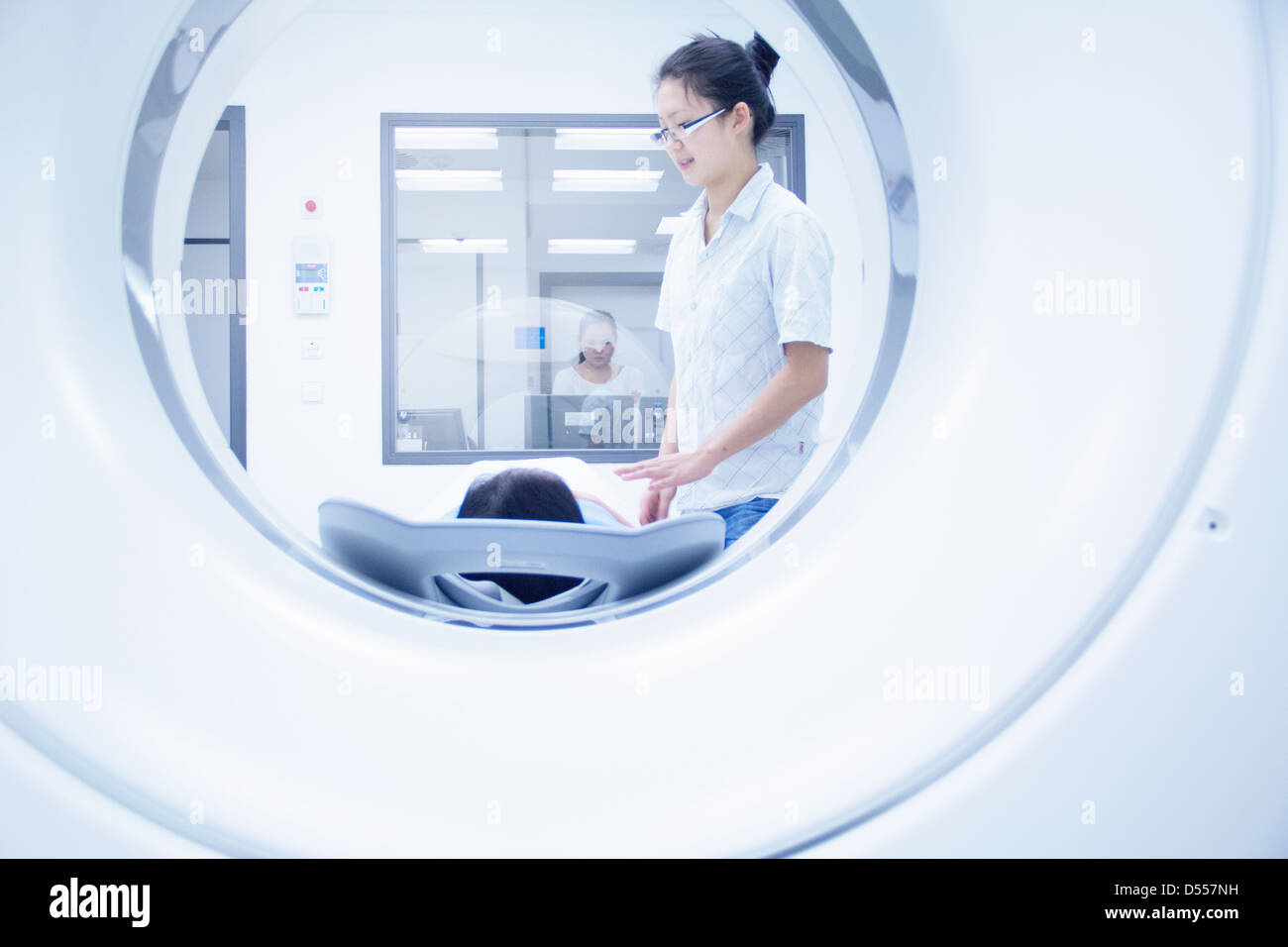 Technician with patient in CT scanner Stock Photo Alamy