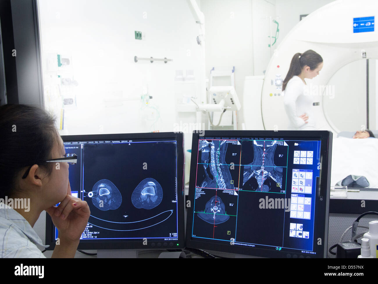 Nurse examining x-rays in hospital Stock Photo