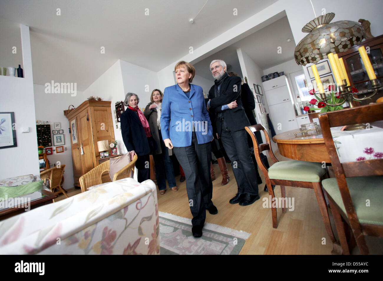 Bad Kreuznach, Germany. 25th March 2013. German Chancellor Angela Merkel (C) visits the 'WohnArt' multi-generational house with architect Gustav Kannwischer (R) and Chairwoman of the Rhineland-Palatinate CDU Julia Kloeckner (2-L) in Bad Kreuznach, Germany, 25 March 2013. According to Merkel, multi-generational houses enrich society. Photo: FREDRIK VON ERICHSEN/dpa/Alamy Live News Stock Photo