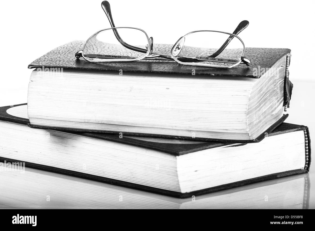 a pile of books and glasses Stock Photo
