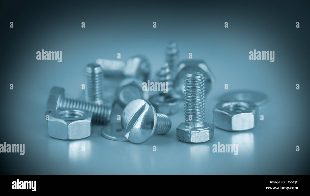 Female-screws and screw-bolts are photographed close-up Stock Photo