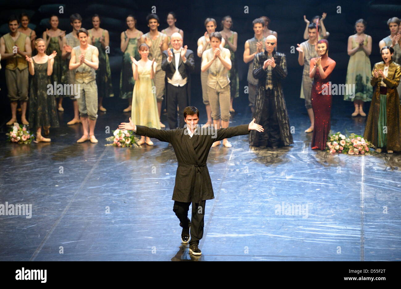 HANDOUT - A handout picture shows choreographer Demis Volpi (C) standing with other members of the ensemble of Stuttgart Ballet after the premiere of the new ballet Krabat at the opera house in Stuttgart, Germany, 22 March 2013. Demis Volpi was asked to be house choreographer after the premiere at the Stuttgart Ballet. Photo: Stuttgarter Ballett Stock Photo