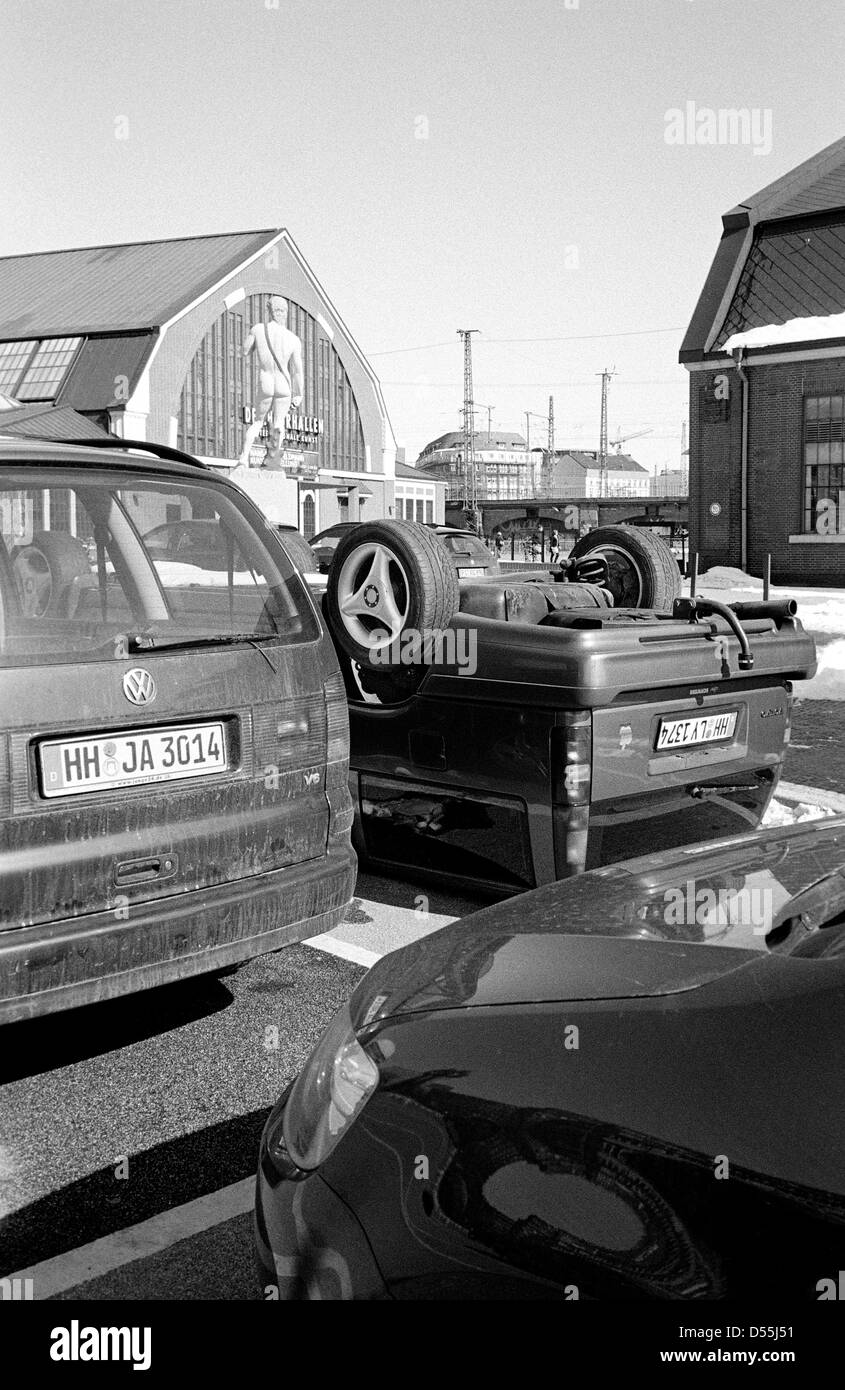 Artist Hans-Peter Feldmann's upside down Volvo in a parking lot at Deichtorhallen in Hamburg. Stock Photo