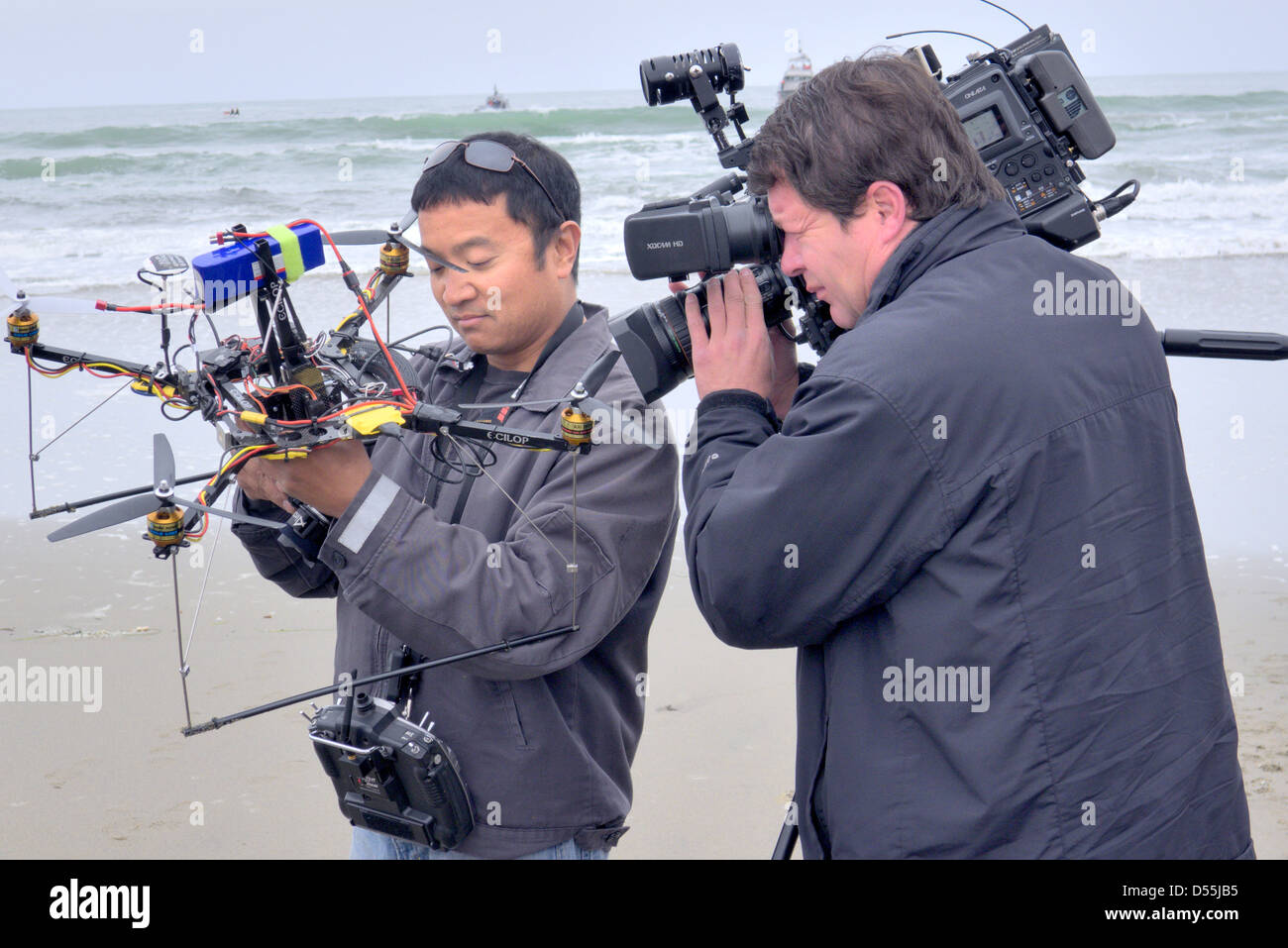 A man demonstrates his flying remote camera drone Stock Photo