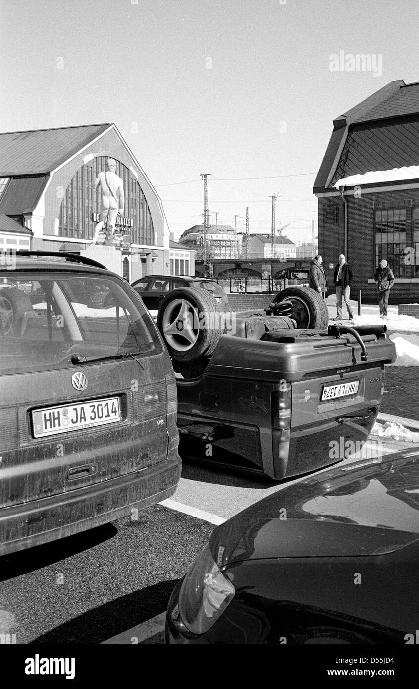 Artist Hans-Peter Feldmann's upside down Volvo in a parking lot at Deichtorhallen in Hamburg. Stock Photo