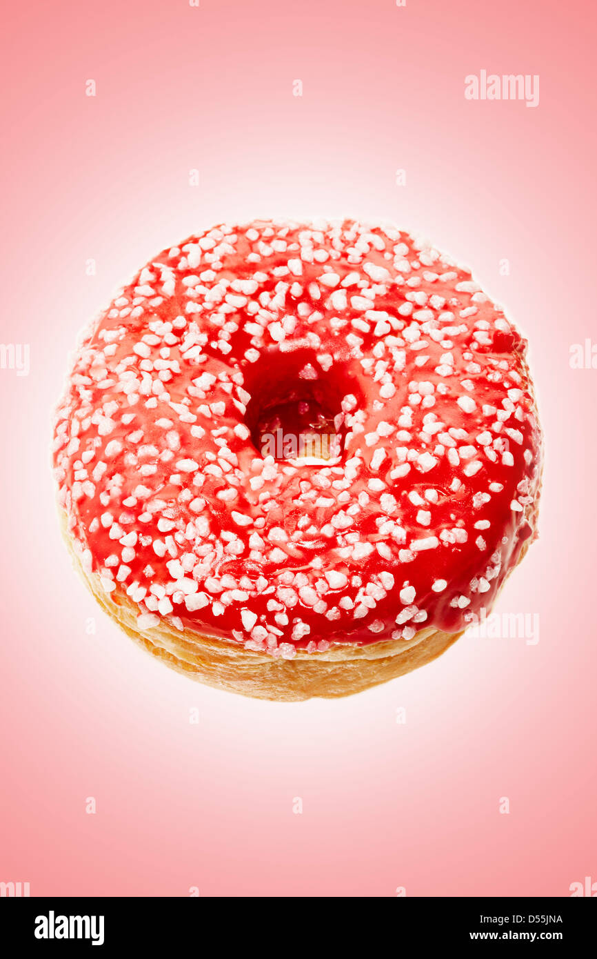doughnut on light red background Stock Photo