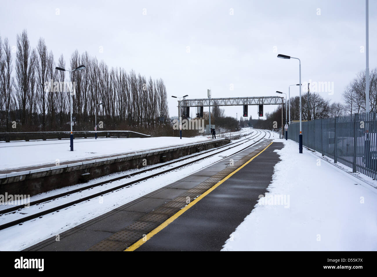 Kettering, Northamptonshire. 24th March, 2013. Kettering railway station was kept open and pasengers could safely walk along the platform despite the snow which engulfed much of the UK. Credit: Miscellaney/Alamy Live News Stock Photo