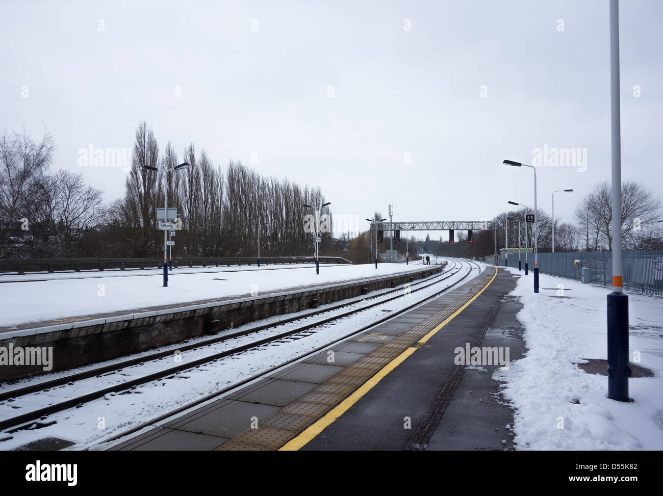 Kettering, Northamptonshire. 24th March, 2013. Kettering railway station was kept open and pasengers could safely walk along the platform despite the snow which engulfed much of the UK. Credit: Miscellaney/Alamy Live News Stock Photo