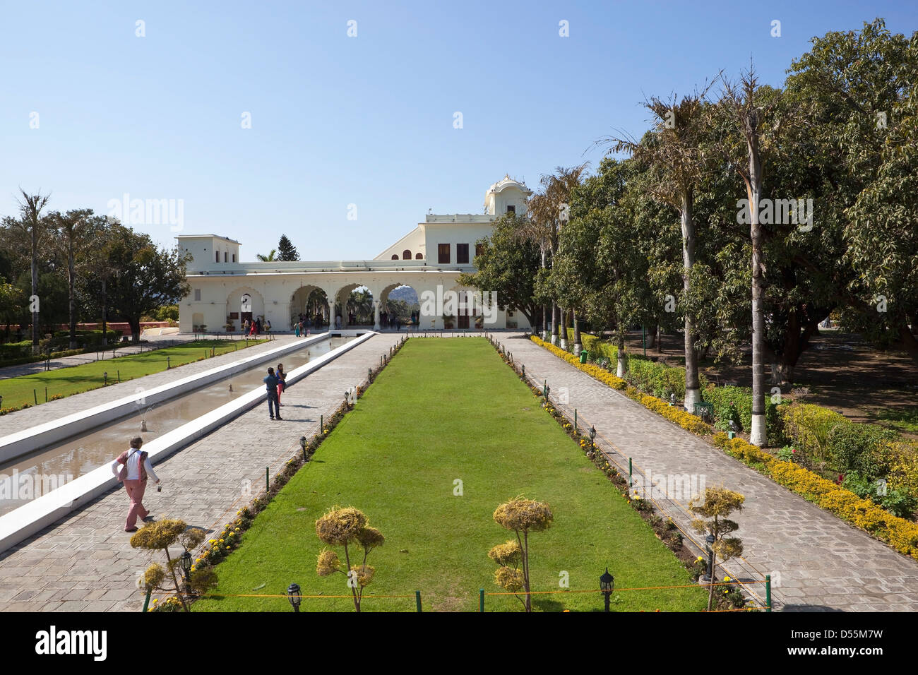 A scenic view at Pinjore Gardens in Haryana, India with white ornate architecture and green lawns. Stock Photo