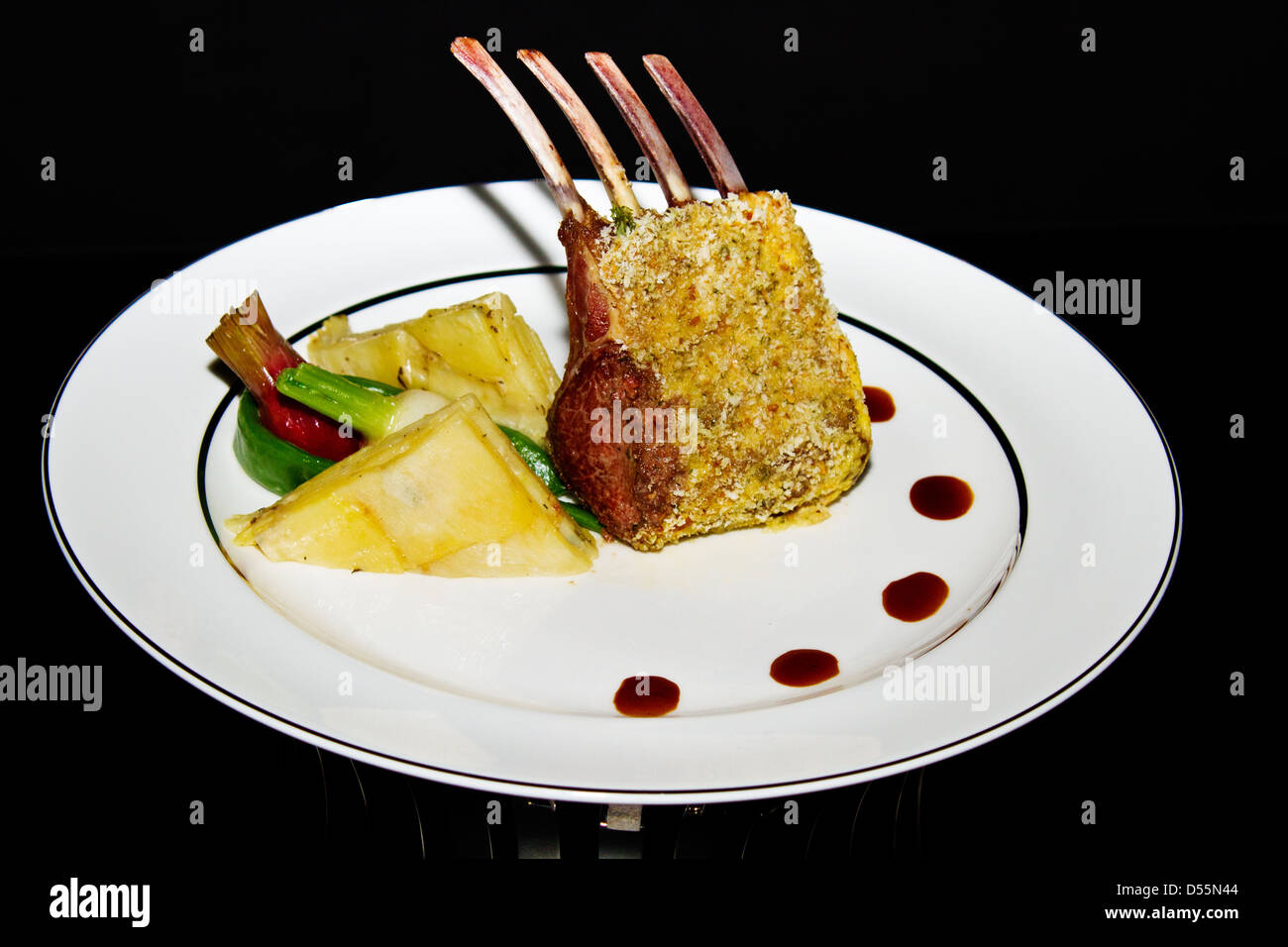 Roasted lamb chop with grain mustard, and garlic sauce Stock Photo Alamy