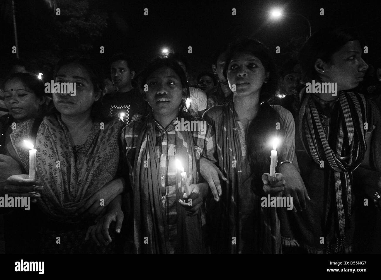 Dhaka, Bangladesh. 25th March, 2013. The organization of  the Ganajagaran Manch uprising at Shahbagh intersection remembered the Dark Night of the 25 March, 1971, wtih a candlelit processing in the capital of Dhaka in 25 march 2012. In 1971 when the Pakistan army attacked Bengali civilians in an attempt to end their peaceful civil disobedience movement spearheaded by Bangabandhu Sheikh Mujibur Rahman which led to independence. Pakistan's military chief and President Yahya Khan ordered the troops to crack down before leaving Dhaka for Pakistan on the evening of Mar 25 Stock Photo
