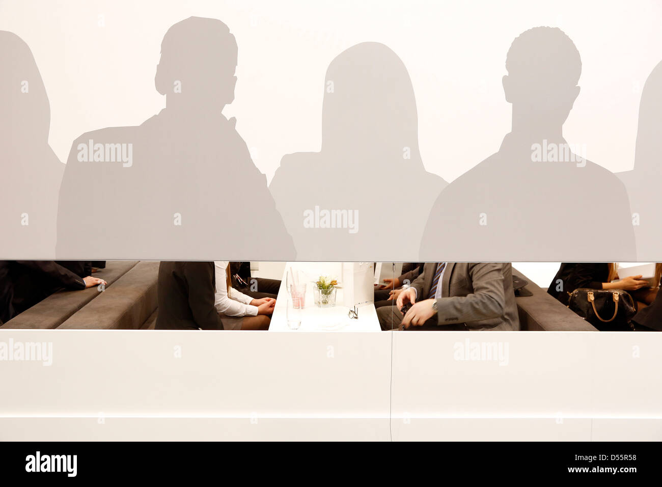 Essen, Germany, managers talk behind a shadow wall Stock Photo