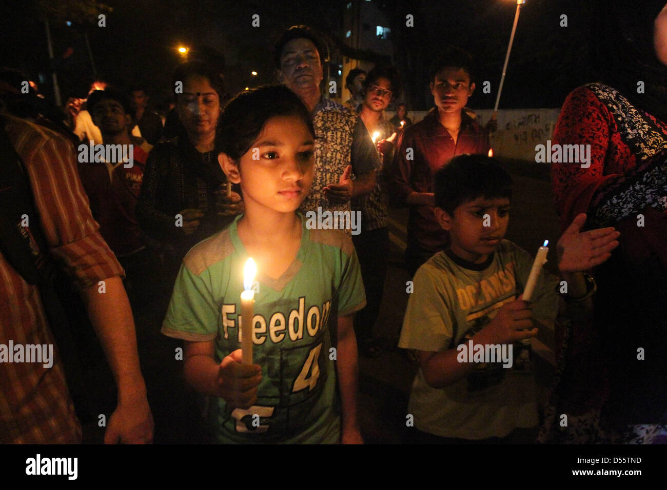 March 25, 2013 - Dhaka, Bangladesh - Marchers lit candles to remember the victims of ''Operation Searchlight,'' the 1971 military operation carried out by the Pakistan Army to curb the Bengali nationalist movement. (Credit Image: © Monirul Alam/ZUMAPRESS.com) Stock Photo