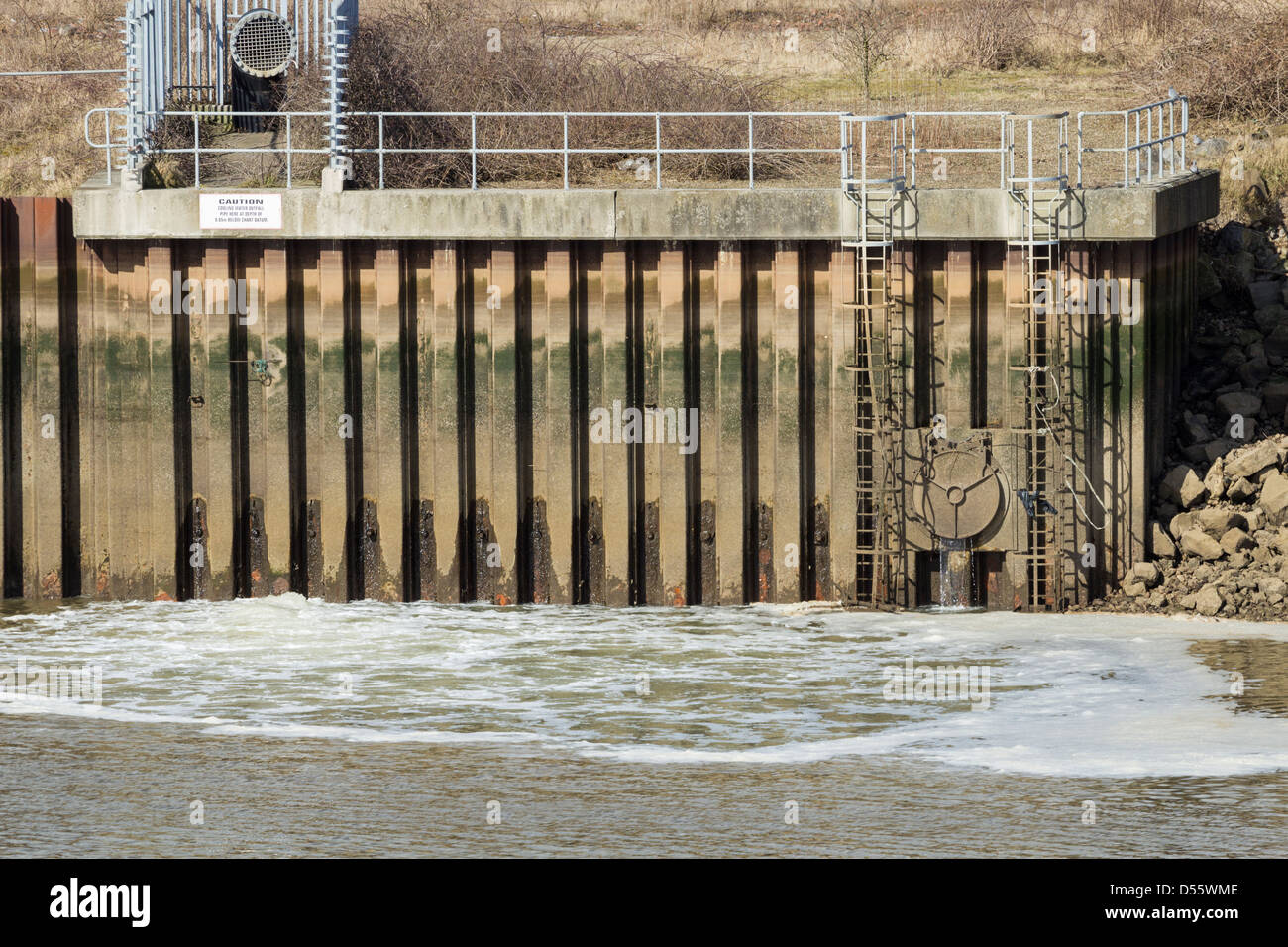 Sewage/storm overflow outflow pipes on River Tees at Middlesbrough, England, UK Stock Photo