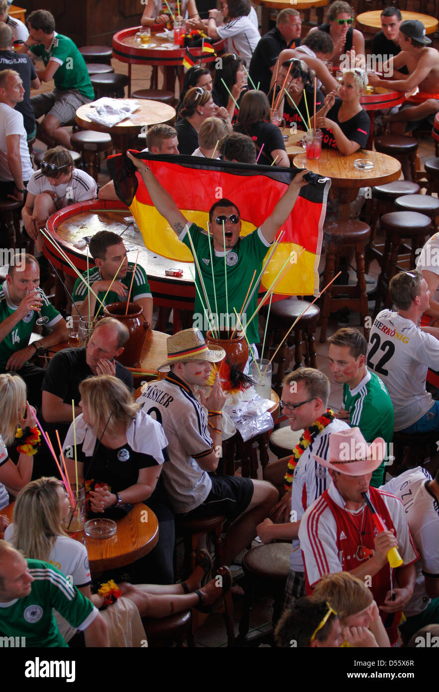 Germany soccer national team supporters react while they watch their European cup semifinal match in sunny island of Mallorca Stock Photo
