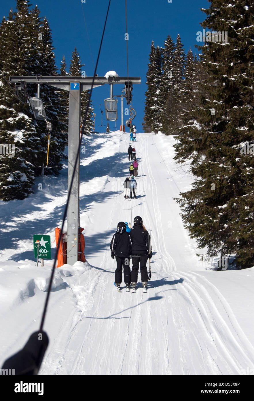 Skiers on a drag-lift in the Swedish resort of Åre (Are) Stock Photo