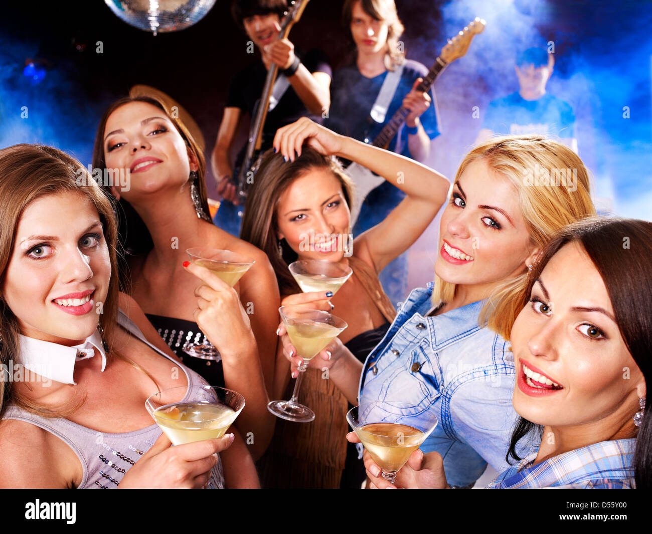 Woman on disco in night club. Stock Photo