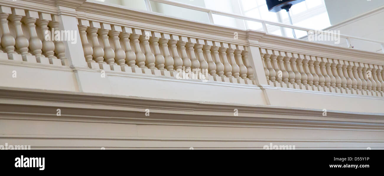 Detail of the carved wood rail of the balcony in Boston's Meeting House. Stock Photo
