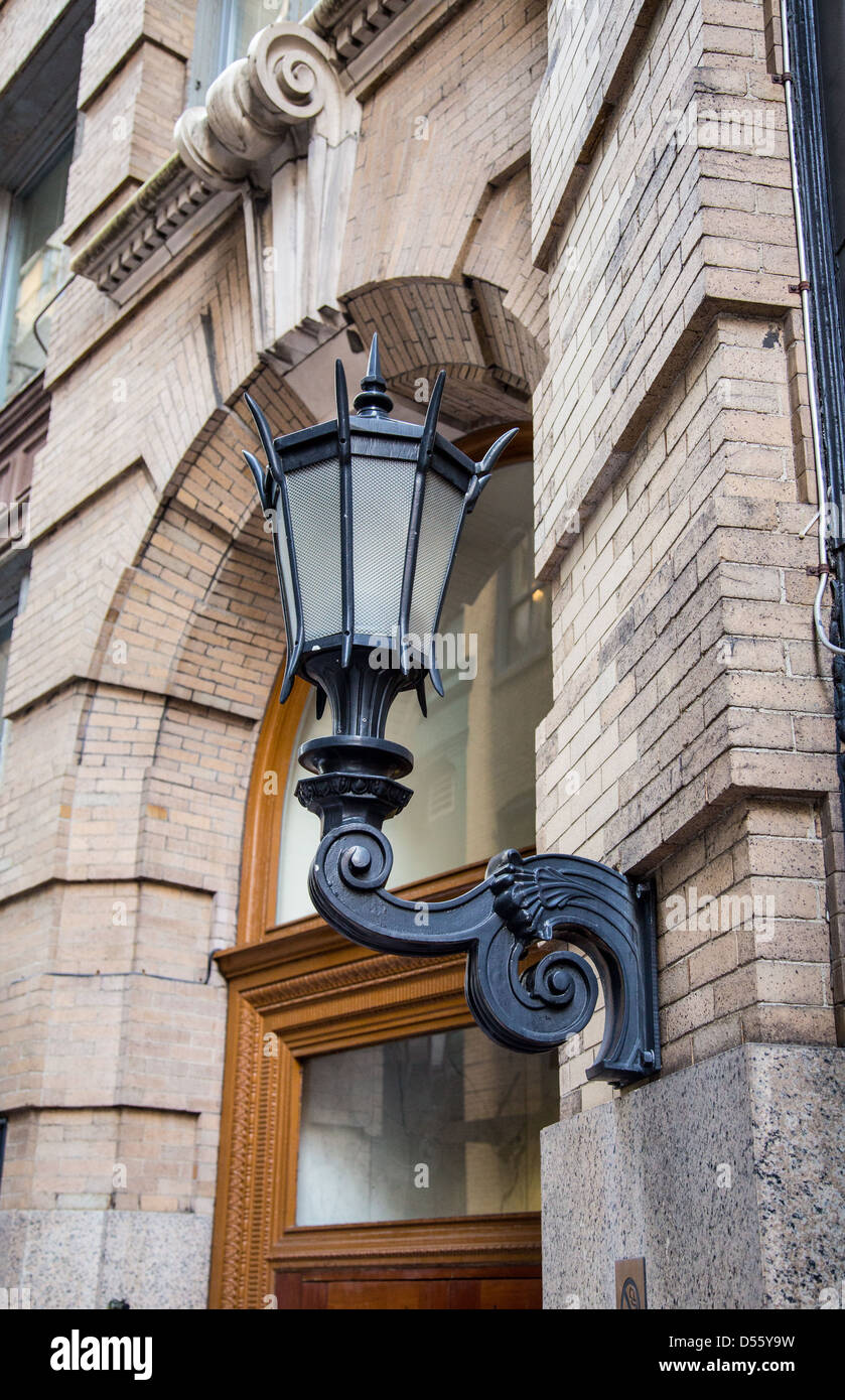 A street light on the side of an historic building in Boston, Massachusetts Stock Photo