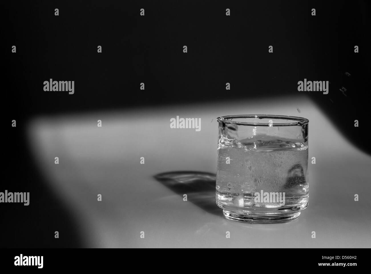 Anti Acid dropped into a glass Stock Photo