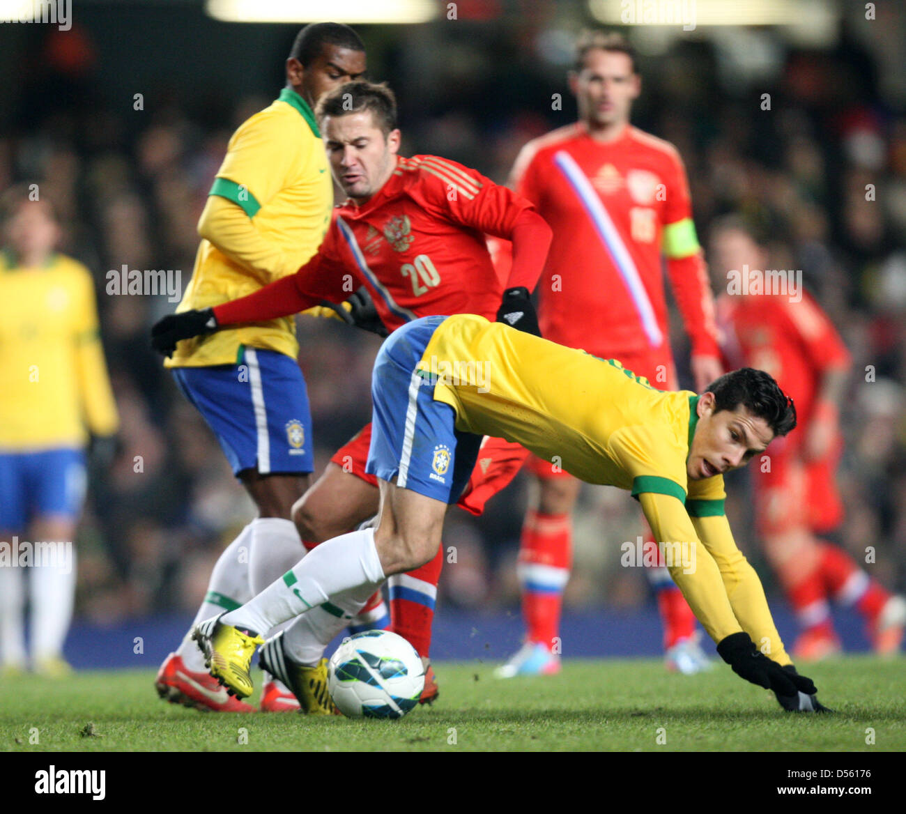 London, UK. 25th March 2013. Hernanes of Brazil and  Fayzulin Victor of Russia during the International Friendly between Brazil and Russia from the Stamford Bridge. Credit: Action Plus Sports Images / Alamy Live News Stock Photo