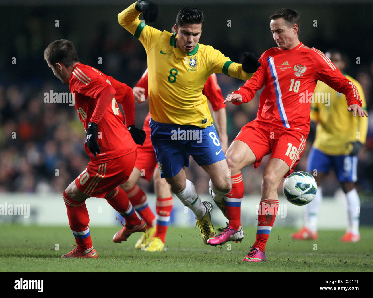 London, UK. 25th March 2013. 25.03.2013 London, England. Hernanes of Brazil and Bystrov Vladimir of Russia  during the International Friendly between Brazil and Russia from the Stamford Bridge. Credit: Action Plus Sports Images / Alamy Live News Stock Photo