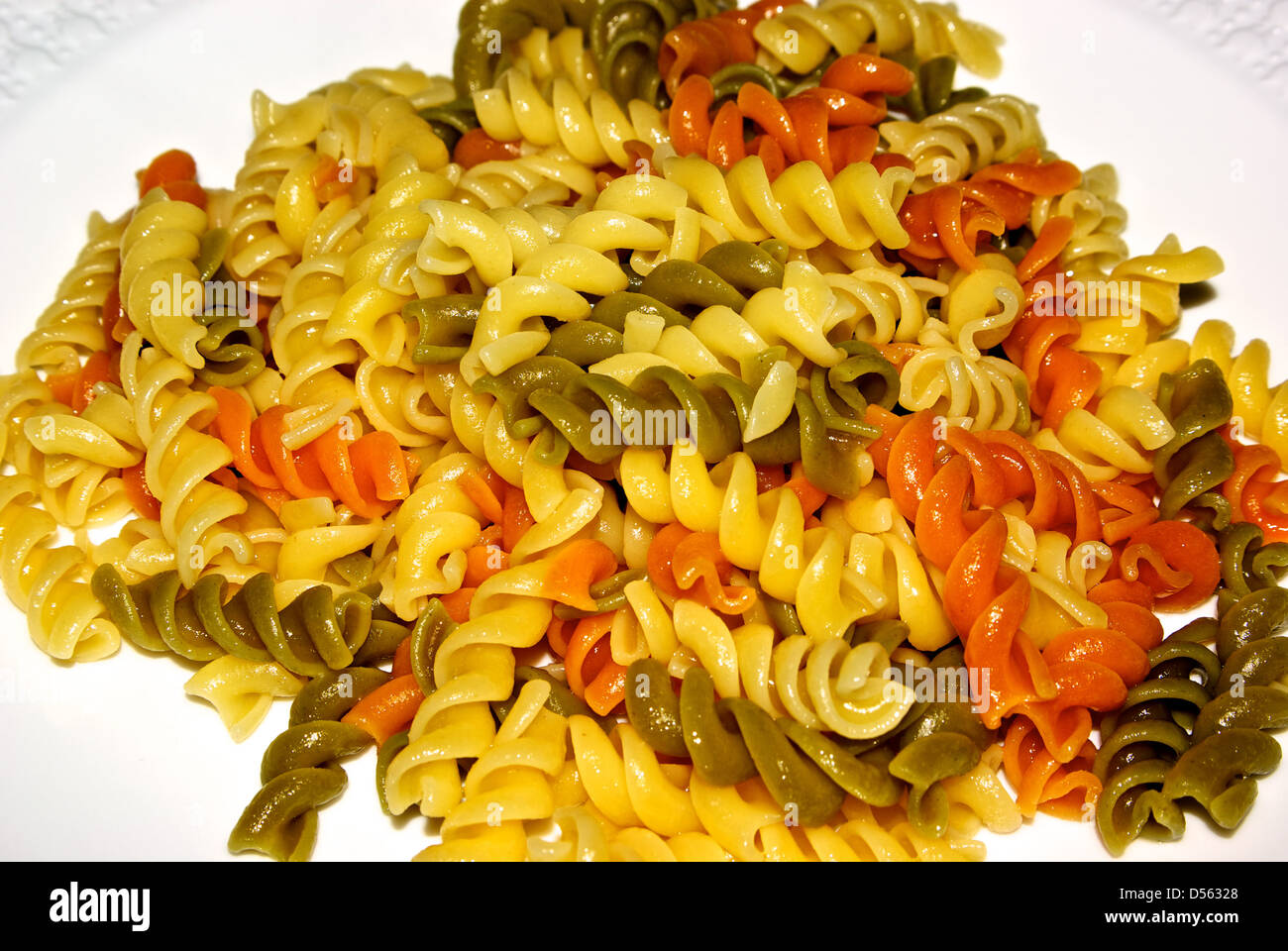 Plate steaming hot cooked tricolour pasta Stock Photo