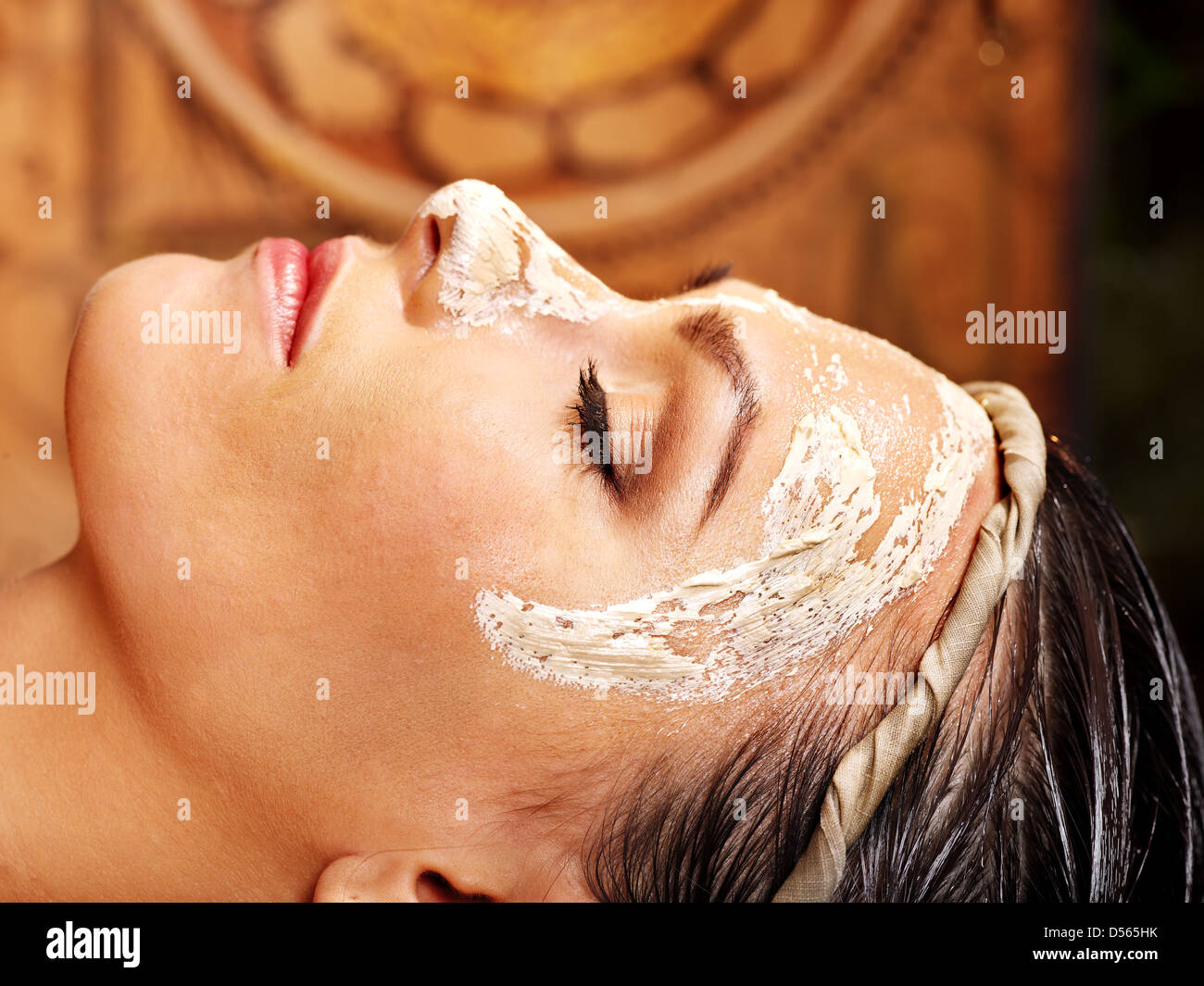 Woman having facial mask at ayurveda spa Stock Photo Alamy