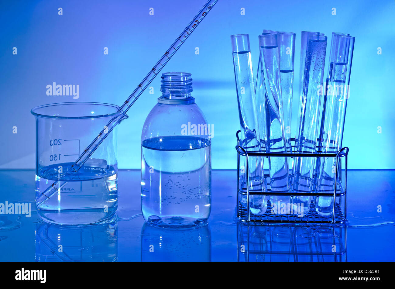 Laboratory glass. Backlight on blue background Stock Photo Alamy