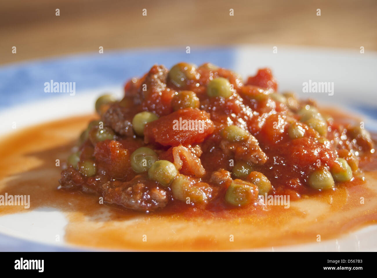 Italian food , peas and tomato Stock Photo