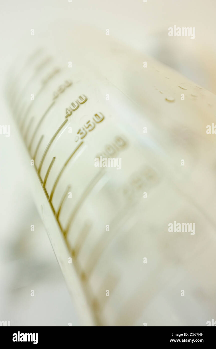 A Graduated Measuring cylinder used in science or photographic laboratories. Stock Photo
