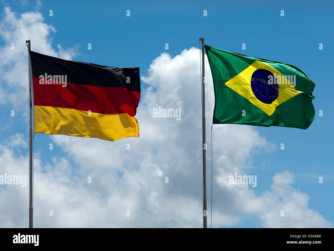 A German (L) and a Brazilian flag sway in the wind during the meeting of German Foreign Minister Guido Westerwelle and his Brazilian counterpart Celso Luiz Nunes Amorim (both unseen) in Brasilia, Brazil, 10 March 2010. Westerwelle is on his so far longest journey abroad, paying visits to Chile, Argentina, Uruguay and Brazil. Photo: ARNO BURGI Stock Photo