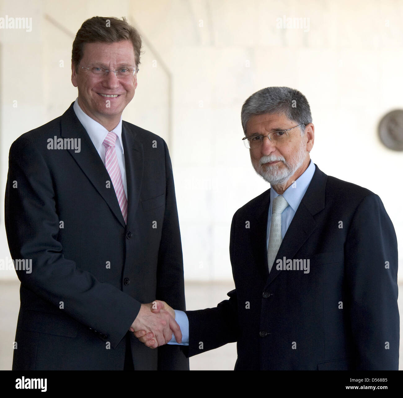 German Foreign Minister Guido Westerwelle (L) and his Brazilian counterpart Celso Luiz Nunes Amorim shake hands as they meet for talks in Brasilia, Brazil, 10 March 2010. Westerwelle is on his so far longest journey abroad, paying visits to Chile, Argentina, Uruguay and Brazil. Photo: ARNO BURGI Stock Photo