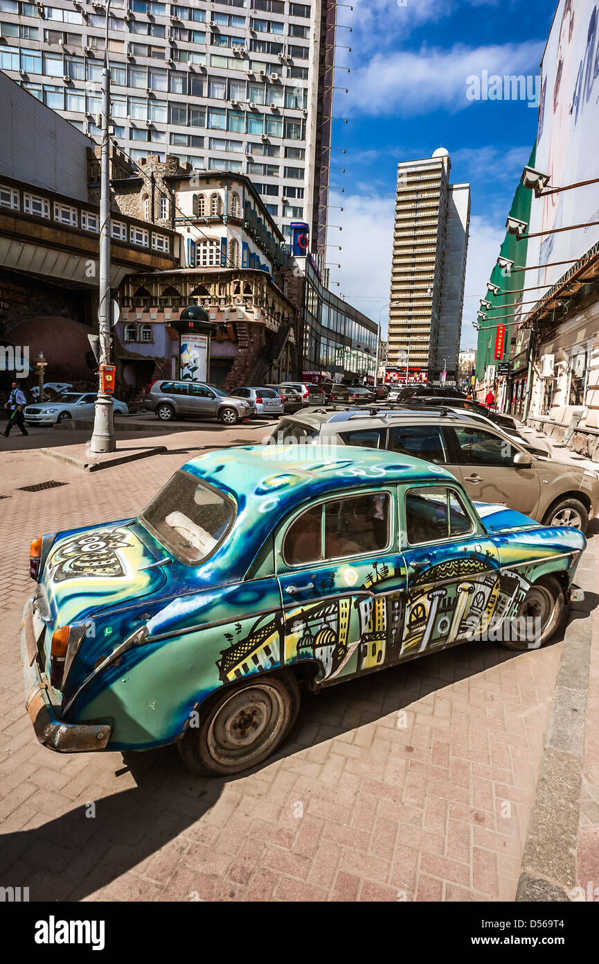 Old painted soviet car on Arbat street in Moscow Stock Photo