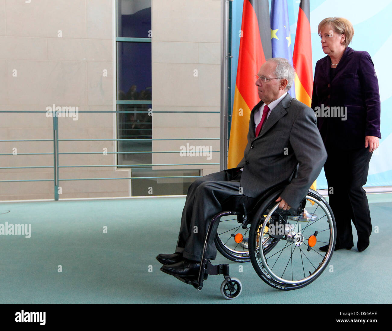 German Finance Minister Wolfgang Schaeuble and German Chancellor Angela Merkel leave a press conference at the Chancellery in Berlin, Germany, 10 November 2010. The politicians informed people of the media on topics of the G-20 summit in South Korea. Photo: WOLFGANG KUMM Stock Photo