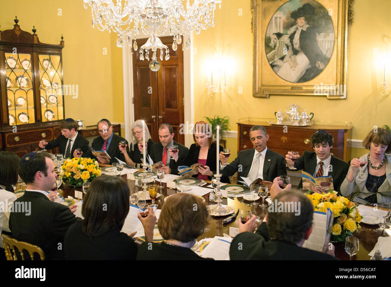 US President Barack Obama and First Lady Michelle Obama host a Passover Seder Dinner for family, staff and friends in the Old Family Dining Room of the White House March 25, 2013 in Washington, DC. Stock Photo