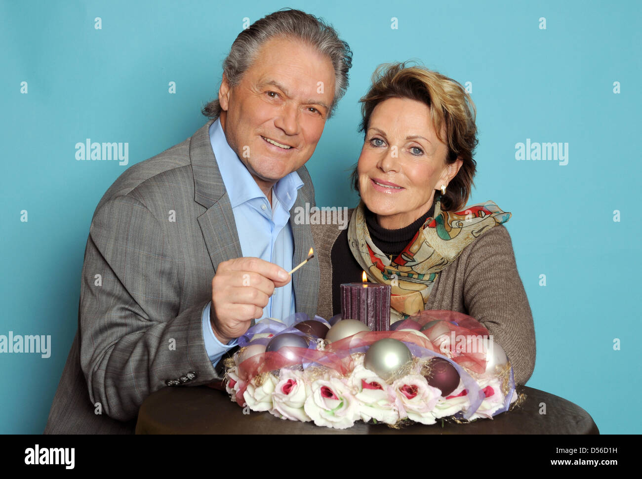 German figure skating icon and actor Hans-Juergen Baeumler (L) and his wife Marina (R) pose during a photo call in Cologne, Germany, 12 November 2010. Photo: Horst Ossinger Stock Photo