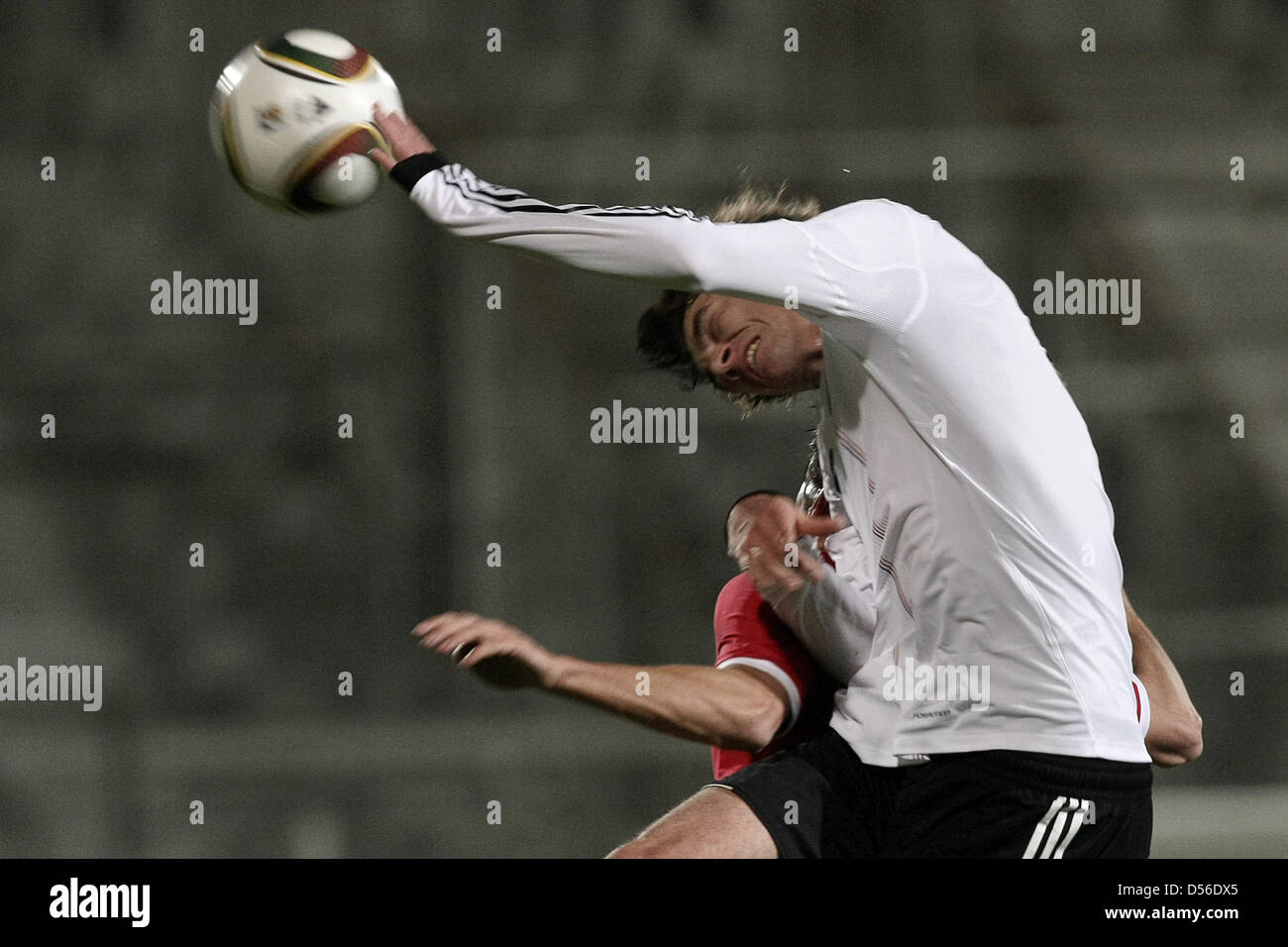 Germany's Stefan Bell (front) and England's Jack Cork (covered) vie for the ball during the U-21 international match Germany vs. England at the Brita-Arena in Wiesbaden, Germany, 16 November 2010. Photo: Fredrik von Erichsen Stock Photo